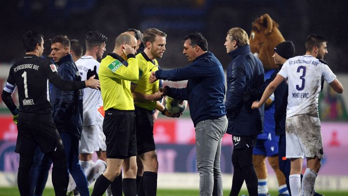 KARLSRUHE, GERMANY - NOVEMBER 11: Head coach Alois Schwarz of Karlsruhe talks to referee Sven Waschitzki after the Second Bundesliga match between Karlsruher SC and FC Erzgebirge Aue at Wildparkstadion on November 11, 2019 in Karlsruhe, Germany. (Photo by Alex Grimm/Bongarts/Getty Images) KARLSRUHE, GERMANY - NOVEMBER 11: Head coach Alois Schwarz of Karlsruhe talks to referee Sven Waschitzki after the Second Bundesliga match between Karlsruher SC and FC Erzgebirge Aue at Wildparkstadion on November 11, 2019 in Karlsruhe, Germany. (Photo by Alex Grimm/Bongarts/Getty Images)