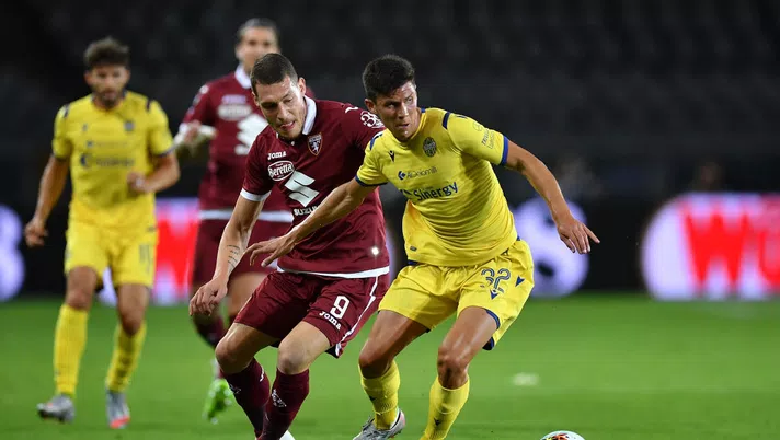 TURIN, ITALY - JULY 22:  Andrea Belotti of Torino FC competes for the ball with Matteo Pessina of Hellas Verona during the Serie A match between Torino FC and  Hellas Verona at Stadio Olimpico di Torino on July 22, 2020 in Turin, Italy.  (Photo by Valerio Pennicino/Getty Images)