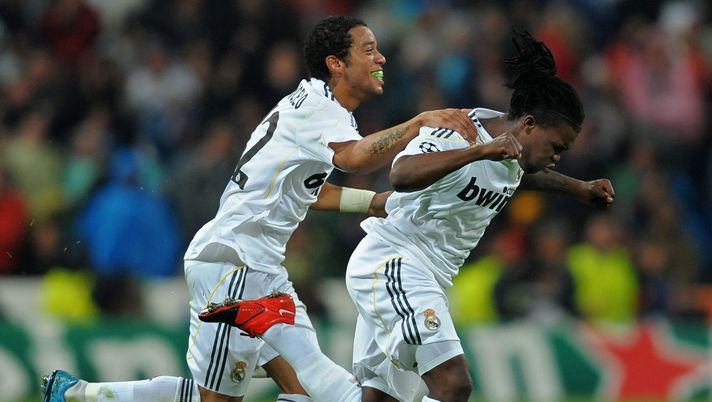 MADRID, SPAIN - OCTOBER 21: Royston Drenthe (R) of Real Madrid celebrates scoring his side equalizing goal with his teammate Marcelo Vieira during the Champions League group C match between Real Madrid and AC Milan at the Estadio Santiago Bernabeu on October 21, 2009 in Madrid, Spain. AC Milan won the match 3-2. (Photo by Jasper Juinen/Getty Images) MADRID, SPAIN - OCTOBER 21: Royston Drenthe (R) of Real Madrid celebrates scoring his side equalizing goal with his teammate Marcelo Vieira during the Champions League group C match between Real Madrid and AC Milan at the Estadio Santiago Bernabeu on October 21, 2009 in Madrid, Spain. AC Milan won the match 3-2. (Photo by Jasper Juinen/Getty Images)