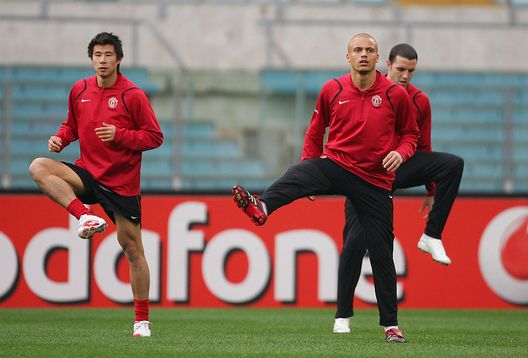 ROME - APRIL 03: Dong Fangzhuo,Wes Brown and John O'Shea of Manchester United warm up during the Manchester United training session ahead of their UEFA Champions League Quarter Final match against AS Roma tomorrow night, at the Olympic Stadium on April 3, 2007 in Rome, Italy. (Photo by Alex Livesey/Getty Images) ROME - APRIL 03: Dong Fangzhuo,Wes Brown and John O'Shea of Manchester United warm up during the Manchester United training session ahead of their UEFA Champions League Quarter Final match against AS Roma tomorrow night, at the Olympic Stadium on April 3, 2007 in Rome, Italy. (Photo by Alex Livesey/Getty Images)
