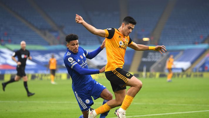 LEICESTER, ENGLAND - NOVEMBER 08: James Justin of Leicester City battles for possession with Raul Jimenez of Wolverhampton Wanderers during the Premier League match between Leicester City and Wolverhampton Wanderers at The King Power Stadium on November 08, 2020 in Leicester, England. Sporting stadiums around the UK remain under strict restrictions due to the Coronavirus Pandemic as Government social distancing laws prohibit fans inside venues resulting in games being played behind closed doors. (Photo by Michael Regan/Getty Images) LEICESTER, ENGLAND - NOVEMBER 08: James Justin of Leicester City battles for possession with Raul Jimenez of Wolverhampton Wanderers during the Premier League match between Leicester City and Wolverhampton Wanderers at The King Power Stadium on November 08, 2020 in Leicester, England. Sporting stadiums around the UK remain under strict restrictions due to the Coronavirus Pandemic as Government social distancing laws prohibit fans inside venues resulting in games being played behind closed doors. (Photo by Michael Regan/Getty Images)