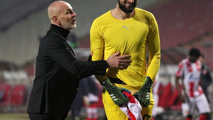 BELGRADE, SERBIA - FEBRUARY 18: Stefano Pioli, Head Coach of A.C. Milan and Gianluigi Donnarumma of A.C. Milan interact during the UEFA Europa League Round of 32 match between Crvena Zvezda and AC Milan at Rajko Mitic Stadium on February 18, 2021 in Belgrade, Serbia. Sporting stadiums around Serbia remain under strict restrictions due to the Coronavirus Pandemic as Government social distancing laws prohibit fans inside venues resulting in games being played behind closed doors. (Photo by Srdjan Stevanovic/Getty Images) BELGRADE, SERBIA - FEBRUARY 18: Stefano Pioli, Head Coach of A.C. Milan and Gianluigi Donnarumma of A.C. Milan interact during the UEFA Europa League Round of 32 match between Crvena Zvezda and AC Milan at Rajko Mitic Stadium on February 18, 2021 in Belgrade, Serbia. Sporting stadiums around Serbia remain under strict restrictions due to the Coronavirus Pandemic as Government social distancing laws prohibit fans inside venues resulting in games being played behind closed doors. (Photo by Srdjan Stevanovic/Getty Images)