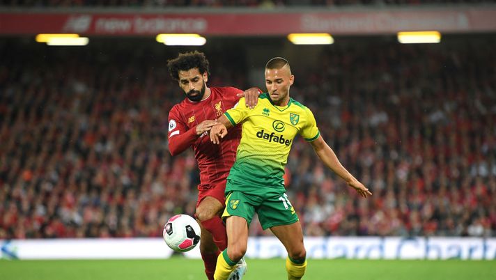 LIVERPOOL, ENGLAND - AUGUST 09: Moritz Leitner of Norwich City and Mohamed Salah of Liverpool during the Premier League match between Liverpool FC and Norwich City at Anfield on August 09, 2019 in Liverpool, United Kingdom. (Photo by Michael Regan/Getty Images) LIVERPOOL, ENGLAND - AUGUST 09: Moritz Leitner of Norwich City and Mohamed Salah of Liverpool during the Premier League match between Liverpool FC and Norwich City at Anfield on August 09, 2019 in Liverpool, United Kingdom. (Photo by Michael Regan/Getty Images)