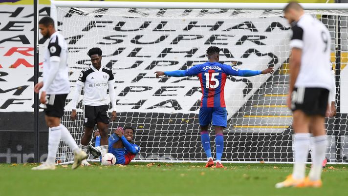 LONDON, ENGLAND - OCTOBER 24: Wilfried Zaha of Crystal Palace goes down injured after scoring his team's second goal during the Premier League match between Fulham and Crystal Palace at Craven Cottage on October 24, 2020 in London, England. Sporting stadiums around the UK remain under strict restrictions due to the Coronavirus Pandemic as Government social distancing laws prohibit fans inside venues resulting in games being played behind closed doors. (Photo by Mike Hewitt/Getty Images) LONDON, ENGLAND - OCTOBER 24: Wilfried Zaha of Crystal Palace goes down injured after scoring his team's second goal during the Premier League match between Fulham and Crystal Palace at Craven Cottage on October 24, 2020 in London, England. Sporting stadiums around the UK remain under strict restrictions due to the Coronavirus Pandemic as Government social distancing laws prohibit fans inside venues resulting in games being played behind closed doors. (Photo by Mike Hewitt/Getty Images)