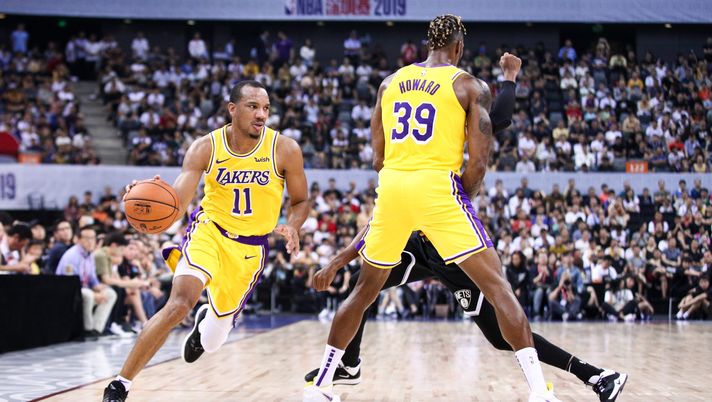 SHENZHEN, CHINA - OCTOBER 12: Avery Bradley #11 and Dwight Howard #39 of the Los Angeles Lakers in action during the match against the Brooklyn Nets during a preseason game as part of 2019 NBA Global Games China at Shenzhen Universiade Center on October 12, 2019 in Shenzhen, Guangdong, China. (Photo by Zhong Zhi/Getty Images) Nba, si parte con Denver-LA Lakers: due finali di Conference e un duello speciale - immagine 1