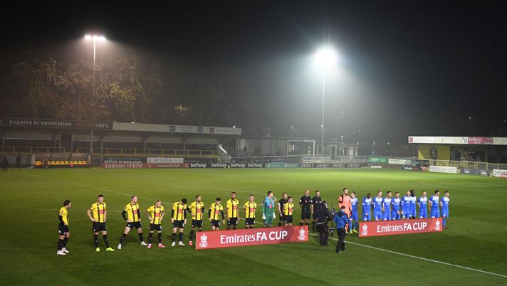 HARROGATE, ENGLAND - NOVEMBER 06: General view inside the stadium as the yeams line up prior to the FA Cup first round match between Harrogate Town and Skelmersdale United on November 06, 2020 in Harrogate, England. Sporting stadiums around the UK remain under strict restrictions due to the Coronavirus Pandemic as Government social distancing laws prohibit fans inside venues resulting in games being played behind closed doors. (Photo by Gareth Copley/Getty Images) HARROGATE, ENGLAND - NOVEMBER 06: General view inside the stadium as the yeams line up prior to the FA Cup first round match between Harrogate Town and Skelmersdale United on November 06, 2020 in Harrogate, England. Sporting stadiums around the UK remain under strict restrictions due to the Coronavirus Pandemic as Government social distancing laws prohibit fans inside venues resulting in games being played behind closed doors. (Photo by Gareth Copley/Getty Images)