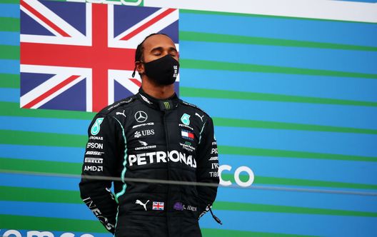 NUERBURG, GERMANY - OCTOBER 11: Race winner Lewis Hamilton of Great Britain and Mercedes GP celebrates on the podium during the F1 Eifel Grand Prix at Nuerburgring on October 11, 2020 in Nuerburg, Germany. (Photo by Joe Portlock/Getty Images) NUERBURG, GERMANY - OCTOBER 11: Race winner Lewis Hamilton of Great Britain and Mercedes GP celebrates on the podium during the F1 Eifel Grand Prix at Nuerburgring on October 11, 2020 in Nuerburg, Germany. (Photo by Joe Portlock/Getty Images)