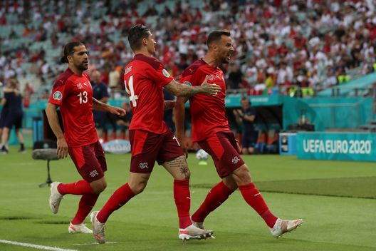 BAKU, AZERBAIJAN - JUNE 20: Haris Seferovic of Switzerland celebrates with teammates Steven Zuber and Ricardo Rodriguez after scoring their team's first goal during the UEFA Euro 2020 Championship Group A match between Switzerland and Turkey at Baku Olimpiya Stadionu on June 20, 2021 in Baku, Azerbaijan. (Photo by Tolga Bozoglu - Pool/Getty Images) BAKU, AZERBAIJAN - JUNE 20: Haris Seferovic of Switzerland celebrates with teammates Steven Zuber and Ricardo Rodriguez after scoring their team's first goal during the UEFA Euro 2020 Championship Group A match between Switzerland and Turkey at Baku Olimpiya Stadionu on June 20, 2021 in Baku, Azerbaijan. (Photo by Tolga Bozoglu - Pool/Getty Images)