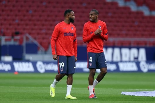 MADRID, SPAIN - MARCH 10: Moussa Dembele (L) of Atletico de Madrid speaks with team mate Geoffrey Kondogbia during the warm up prior to the La Liga Santander match between Atletico de Madrid and Athletic Club at Estadio Wanda Metropolitano on March 10, 2021 in Madrid, Spain. Sporting stadiums around Spain remain under strict restrictions due to the Coronavirus Pandemic as Government social distancing laws prohibit fans inside venues resulting in games being played behind closed doors. (Photo by Angel Martinez/Getty Images) MADRID, SPAIN - MARCH 10: Moussa Dembele (L) of Atletico de Madrid speaks with team mate Geoffrey Kondogbia during the warm up prior to the La Liga Santander match between Atletico de Madrid and Athletic Club at Estadio Wanda Metropolitano on March 10, 2021 in Madrid, Spain. Sporting stadiums around Spain remain under strict restrictions due to the Coronavirus Pandemic as Government social distancing laws prohibit fans inside venues resulting in games being played behind closed doors. (Photo by Angel Martinez/Getty Images)