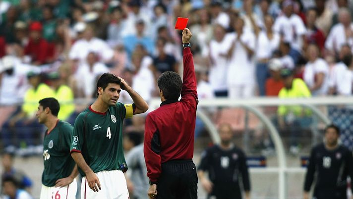 JEONJU - JUNE 17: Rafael Marquez of Mexico is sent off by referee Vitor Melo Pereira for a foul on Cobi Jones of the USA during the Mexico v USA, World Cup Second Round match played at the Jeonju World Cup Stadium, Jeonju, South Korea on June 17, 2002. The USA won 2-0. (Photo by Gary M. Prior/Getty Images) JEONJU - JUNE 17: Rafael Marquez of Mexico is sent off by referee Vitor Melo Pereira for a foul on Cobi Jones of the USA during the Mexico v USA, World Cup Second Round match played at the Jeonju World Cup Stadium, Jeonju, South Korea on June 17, 2002. The USA won 2-0. (Photo by Gary M. Prior/Getty Images)