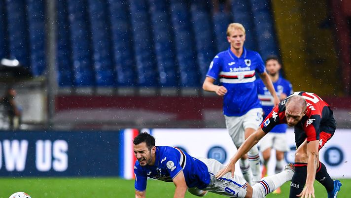 GENOA, ITALY - JULY 22: Andrea Masiello of Genoa (right) tackles Federico Bonazzoli of Sampdoria during the Serie A match between UC Sampdoria and Genoa CFC at Stadio Luigi Ferraris on July 22, 2020 in Genoa, Italy. (Photo by Paolo Rattini/Getty Images) GENOA, ITALY - JULY 22: Andrea Masiello of Genoa (right) tackles Federico Bonazzoli of Sampdoria during the Serie A match between UC Sampdoria and Genoa CFC at Stadio Luigi Ferraris on July 22, 2020 in Genoa, Italy. (Photo by Paolo Rattini/Getty Images)