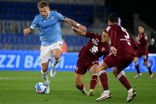 ROME, ITALY - APRIL 16: Ciro Immobile of SS Lazio compete for ythe ball with Samuele Ricci of Torino FC during the Serie A match between SS Lazio and Torino FC at Stadio Olimpico on April 16, 2022 in Rome, Italy. (Photo by Marco Rosi - SS Lazio/Getty Images) Lazio-Torino