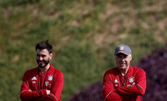 DOHA, QATAR - JANUARY 05: Assistant coach Davide Ancelotti and head coach Carlo Ancelotti smile during a training session at day 3 of the Bayern Muenchen training camp at Aspire Academy on January 5, 2017 in Doha, Qatar. (Photo by Lars Baron/Bongarts/Getty Images) DOHA, QATAR - JANUARY 05: Assistant coach Davide Ancelotti and head coach Carlo Ancelotti smile during a training session at day 3 of the Bayern Muenchen training camp at Aspire Academy on January 5, 2017 in Doha, Qatar. (Photo by Lars Baron/Bongarts/Getty Images)