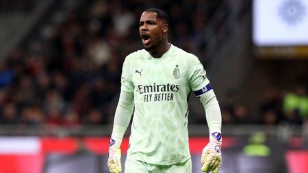 MILAN, ITALY - APRIL 02: Mike Maignan of AC Milan reacts during the Coppa Italia Semi Final match between AC Milan and FC Internazionale at Stadio Giuseppe Meazza on April 02, 2025 in Milan, Italy. (Photo by Marco Luzzani/Getty Images)