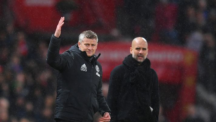 MANCHESTER, ENGLAND - MARCH 08: Manchester United manager Ole Gunnar Solskjaer and Manchester City manager Pep Guardiola look on during the Premier League match between Manchester United and Manchester City at Old Trafford on March 08, 2020 in Manchester, United Kingdom. (Photo by Michael Regan/Getty Images) MANCHESTER, ENGLAND - MARCH 08: Manchester United manager Ole Gunnar Solskjaer and Manchester City manager Pep Guardiola look on during the Premier League match between Manchester United and Manchester City at Old Trafford on March 08, 2020 in Manchester, United Kingdom. (Photo by Michael Regan/Getty Images)