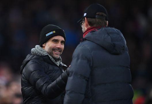 LIVERPOOL, ENGLAND - NOVEMBER 10: Josep Guardiola of Manchester City is greeted by Jurgen Klopp of Liverpool looks on with ta smile ahead of the Premier League match between Liverpool FC and Manchester City at Anfield on November 10, 2019 in Liverpool, United Kingdom. (Photo by Laurence Griffiths/Getty Images) Guardiola: “Liverpool? Dei veri rompiballe”. E i numeri non gli danno torto…- immagine 2