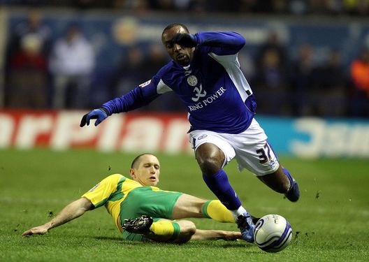 LEICESTER, ENGLAND - MARCH 08: Darius Vassell of Leicester is challenged by Zak Whitbread of Norwich during the npower Championship match between Leicester City and Norwich City at Walkers Stadium on March 8, 2011 in Leicester, England. (Photo by Ross Kinnaird/Getty Images) LEICESTER, ENGLAND - MARCH 08: Darius Vassell of Leicester is challenged by Zak Whitbread of Norwich during the npower Championship match between Leicester City and Norwich City at Walkers Stadium on March 8, 2011 in Leicester, England. (Photo by Ross Kinnaird/Getty Images)