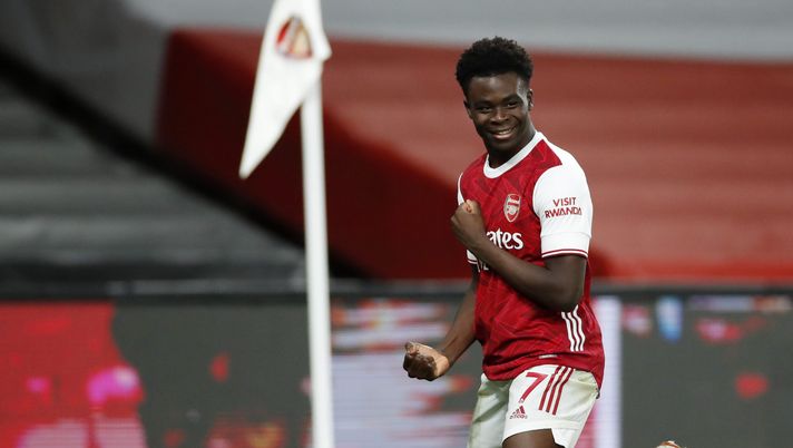 LONDON, ENGLAND - DECEMBER 26: Bukayo Saka of Arsenal celebrates after scoring his team's third goal during the Premier League match between Arsenal and Chelsea at Emirates Stadium on December 26, 2020 in London, England. The match will be played without fans, behind closed doors as a Covid-19 precaution. (Photo by Andrew Boyers - Pool/Getty Images) LONDON, ENGLAND - DECEMBER 26: Bukayo Saka of Arsenal celebrates after scoring his team's third goal during the Premier League match between Arsenal and Chelsea at Emirates Stadium on December 26, 2020 in London, England. The match will be played without fans, behind closed doors as a Covid-19 precaution. (Photo by Andrew Boyers - Pool/Getty Images)