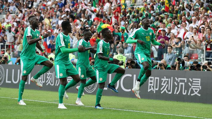 MOSCOW, RUSSIA - JUNE 19: Mbaye Niang of Senegal celebrates with teammates after scoring his team's second goal during the 2018 FIFA World Cup Russia group H match between Poland and Senegal at Spartak Stadium on June 19, 2018 in Moscow, Russia. (Photo by Catherine Ivill/Getty Images) MOSCOW, RUSSIA - JUNE 19: Mbaye Niang of Senegal celebrates with teammates after scoring his team's second goal during the 2018 FIFA World Cup Russia group H match between Poland and Senegal at Spartak Stadium on June 19, 2018 in Moscow, Russia. (Photo by Catherine Ivill/Getty Images)