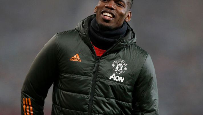 MANCHESTER, ENGLAND - FEBRUARY 02: Paul Pogba of Manchester United looks on prior to the Premier League match between Manchester United and Southampton at Old Trafford on February 02, 2021 in Manchester, England. Sporting stadiums around the UK remain under strict restrictions due to the Coronavirus Pandemic as Government social distancing laws prohibit fans inside venues resulting in games being played behind closed doors. (Photo by Phil Noble - Pool/Getty Images) Raiola: “Pogba ha Torino nel cuore e tiene a queste cose, dipende da cosa vorrà la Juve” - immagine 1