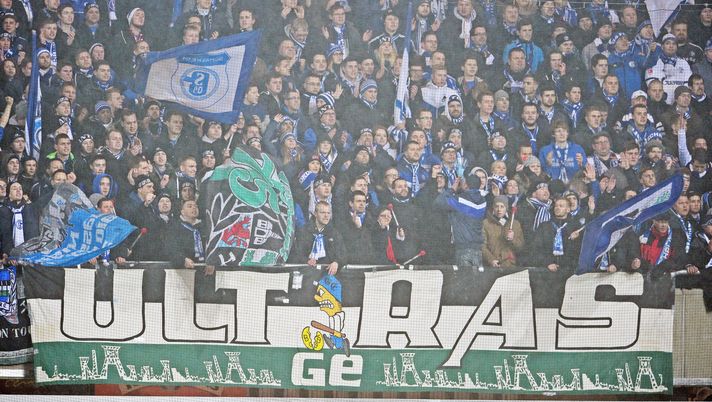PADERBORN, GERMANY - DECEMBER 17: Supporters of Schalke cheer their team during the Bundesliga match between SC Paderborn and FC Schalke 04 at Benteler Arena on December 17, 2014 in Paderborn, Germany. (Photo by Thomas Starke/Bongarts/Getty Images) PADERBORN, GERMANY - DECEMBER 17: Supporters of Schalke cheer their team during the Bundesliga match between SC Paderborn and FC Schalke 04 at Benteler Arena on December 17, 2014 in Paderborn, Germany. (Photo by Thomas Starke/Bongarts/Getty Images)
