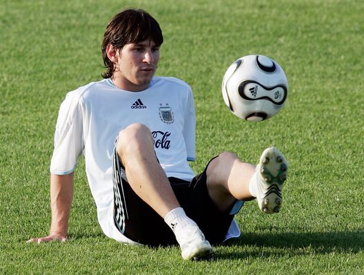 HERZOGENAURACH, GERMANY - JUNE 27: Lionel Messi of Argentina plays with a ball during a training session at the Adi-Dassler Sports Field on June 27, 2006 in Herzogenaurach, Germany. Argentina plays Germany in a quarterfinal match on June 30, 2006 in Berlin, Germany. (Photo by Jan Pitman/Bongarts/Getty Images) HERZOGENAURACH, GERMANY - JUNE 27: Lionel Messi of Argentina plays with a ball during a training session at the Adi-Dassler Sports Field on June 27, 2006 in Herzogenaurach, Germany. Argentina plays Germany in a quarterfinal match on June 30, 2006 in Berlin, Germany. (Photo by Jan Pitman/Bongarts/Getty Images)