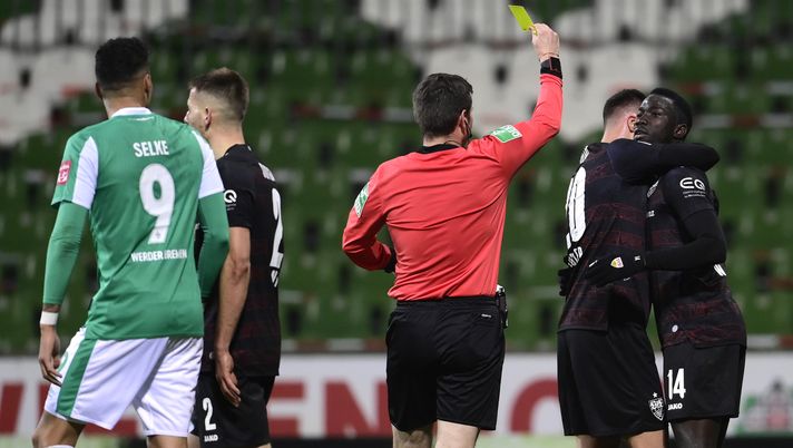 BREMEN, GERMANY - DECEMBER 06: Silas Wamangituka of VfB Stuttgart is shown a yellow card after celebrating scoring their sides second goal during the Bundesliga match between SV Werder Bremen and VfB Stuttgart at Wohninvest Weserstadion on December 06, 2020 in Bremen, Germany. Sporting stadiums around Germany remain under strict restrictions due to the Coronavirus Pandemic as Government social distancing laws prohibit fans inside venues resulting in games being played behind closed doors. (Photo by Oliver Hardt/Getty Images) BREMEN, GERMANY - DECEMBER 06: Silas Wamangituka of VfB Stuttgart is shown a yellow card after celebrating scoring their sides second goal during the Bundesliga match between SV Werder Bremen and VfB Stuttgart at Wohninvest Weserstadion on December 06, 2020 in Bremen, Germany. Sporting stadiums around Germany remain under strict restrictions due to the Coronavirus Pandemic as Government social distancing laws prohibit fans inside venues resulting in games being played behind closed doors. (Photo by Oliver Hardt/Getty Images)