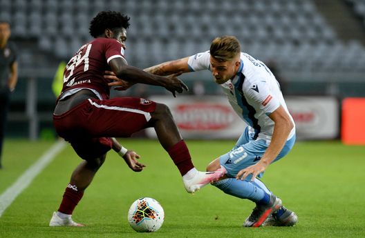  TURIN, ITALY - JUNE 30: Sergej Milinkovic Savic of SS Lazio compete for the ball with Ola Aina of Torino FC during the Serie A match between Torino FC and SS Lazio at Stadio Olimpico di Torino on June 30, 2020 in Turin, Italy. (Photo by Marco Rosi - SS Lazio/Getty Images) 