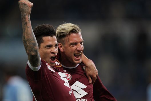  ROME, ITALY - MARCH 13: Maxi Lopez with his teammate Juan Iturbe of FC Torino celebrates after scoring the team's first goal during the Serie A match between SS Lazio and FC Torino at Stadio Olimpico on March 13, 2017 in Rome, Italy. (Photo by Paolo Bruno/Getty Images) 