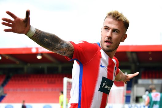  HEIDENHEIM, GERMANY - JUNE 13: Stefan Schimmer (not in frame) of FC Heidenheim 1846 scores his teams fourth goal of the game as team mate Niklas Dorsch who set it up celebrates during the Second Bundesliga match between 1. FC Heidenheim 1846 and SSV Jahn Regensburg at Voith-Arena on June 13, 2020 in Heidenheim, Germany. (Photo by Sebastian Widmann/Getty Images) 