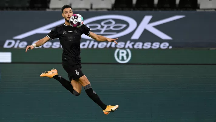 MOENCHENGLADBACH, GERMANY - OCTOBER 31: Moenchengladbach's Ramy Bensebaini in action during the Bundesliga match between Borussia Moenchengladbach and RB Leipzig at Borussia-Park on October 31, 2020 in Moenchengladbach, Germany. (Photo by Sascha Steinbach - Pool/Getty Images)