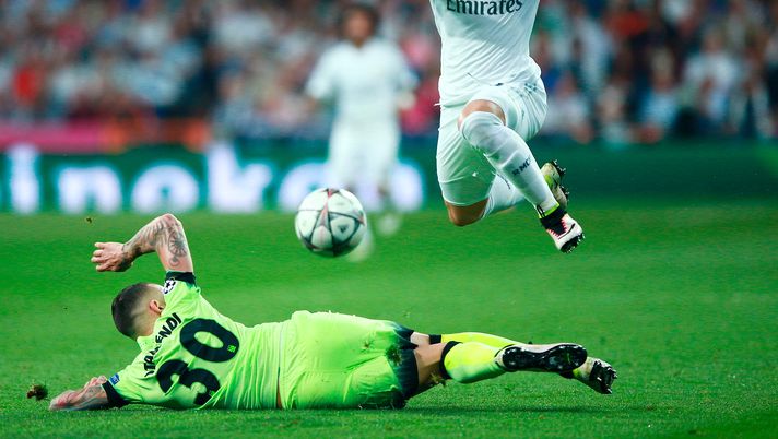 MADRID, SPAIN - MAY 04:  Nicolas Otamendi of Manchester City makes a tackle on Jese of Real Madrid  during the UEFA Champions League semi final, second leg match between Real Madrid and Manchester City FC at Estadio Santiago Bernabeu on May 4, 2016 in Madrid, Spain.  (Photo by Gonzalo Arroyo Moreno/Getty Images) 