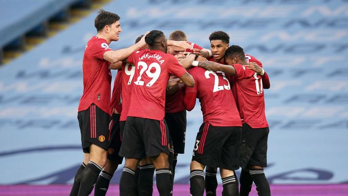 MANCHESTER, ENGLAND - MARCH 07: Luke Shaw of Manchester United celebrates with Harry Maguire, Anthony Martial, Aaron Wan-Bissaka, Marcus Rashford and Fred after scoring their side's second goal during the Premier League match between Manchester City and Manchester United at Etihad Stadium on March 07, 2021 in Manchester, England. Sporting stadiums around the UK remain under strict restrictions due to the Coronavirus Pandemic as Government social distancing laws prohibit fans inside venues resulting in games being played behind closed doors. (Photo by Dave Thompson - Pool/Getty Images) MANCHESTER, ENGLAND - MARCH 07: Luke Shaw of Manchester United celebrates with Harry Maguire, Anthony Martial, Aaron Wan-Bissaka, Marcus Rashford and Fred after scoring their side's second goal during the Premier League match between Manchester City and Manchester United at Etihad Stadium on March 07, 2021 in Manchester, England. Sporting stadiums around the UK remain under strict restrictions due to the Coronavirus Pandemic as Government social distancing laws prohibit fans inside venues resulting in games being played behind closed doors. (Photo by Dave Thompson - Pool/Getty Images)