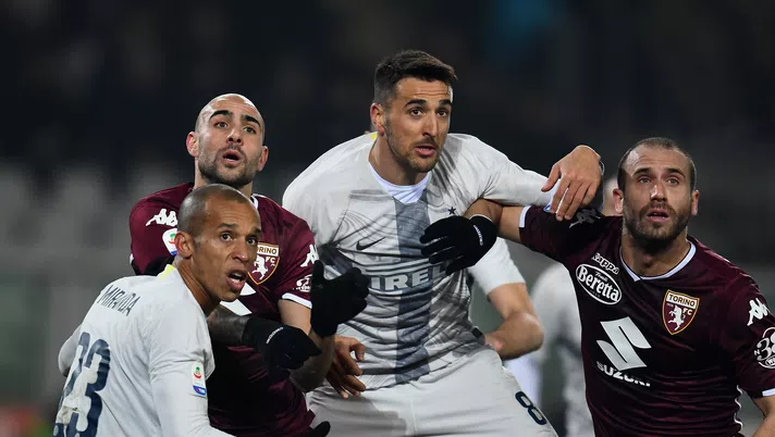 TURIN, ITALY - JANUARY 27:  Joao Miranda de Souza Filho of FC Internazionale, Simone Zaza, Matias Vecino of FC Internazionale and Lorenzo De Silvestri of Torino FC compete for the ball during the Serie A match between Torino FC 