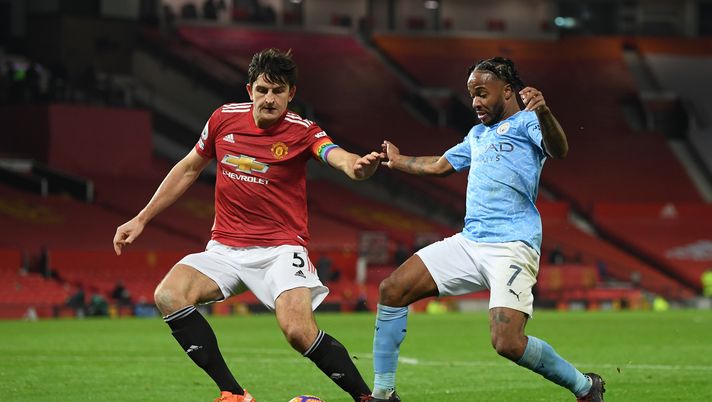 MANCHESTER, ENGLAND - DECEMBER 12: Harry Maguire of Manchester United battles for possession with Raheem Sterling of Manchester City during the Premier League match between Manchester United and Manchester City at Old Trafford on December 12, 2020 in Manchester, England. The match will be played without fans, behind closed doors as a Covid-19 precaution. (Photo by Michael Regan/Getty Images) MANCHESTER, ENGLAND - DECEMBER 12: Harry Maguire of Manchester United battles for possession with Raheem Sterling of Manchester City during the Premier League match between Manchester United and Manchester City at Old Trafford on December 12, 2020 in Manchester, England. The match will be played without fans, behind closed doors as a Covid-19 precaution. (Photo by Michael Regan/Getty Images)