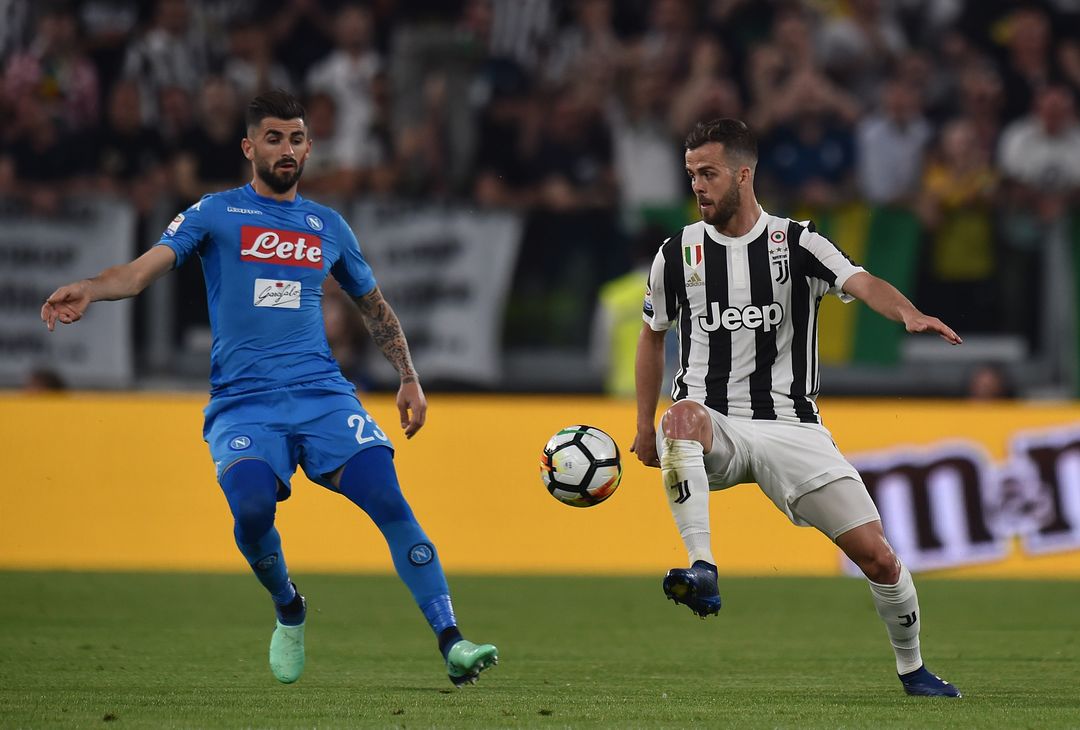  TURIN, ITALY - APRIL 22:  Miralem Pjanic of Juventus competes for the ball with Elseid Hysaj of SSC Napoli during the serie A match between Juventus and SSC Napoli on April 22, 2018 in Turin, Italy.  (Photo by Tullio Puglia - Juventus/Juventus FC via Getty Images) 