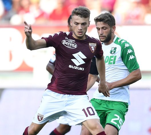  TURIN, ITALY - AUGUST 27: Adem Ljajic (L) of Torino FC is challenged by Domenico Berardi of US Sassuolo during the Serie A match between Torino FC and US Sassuolo FC at Stadio Olimpico Grande Torino on August 27, 2017 in Turin, Italy. (Photo by Valerio Pennicino/Getty Images) 
