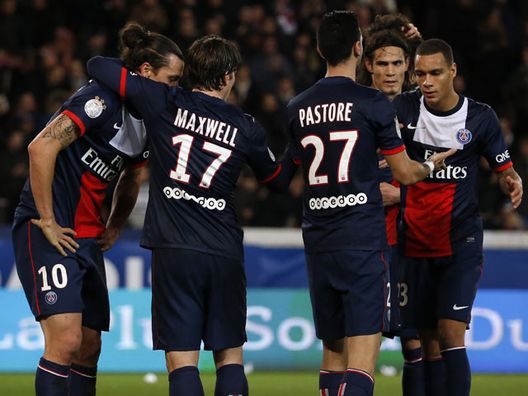 Paris Saint-Germain's players celebrate after Swedish forward Zlatan Ibrahimovic (L) scored a goal during the French L1 football match between PSG and Nice at the Parc des Princes in Paris on November 9, 2013.  AFP PHOTO / THOMAS SAMSON        (Photo credit should read THOMAS SAMSON/AFP/Getty Images) 