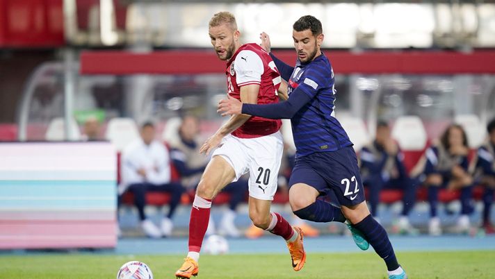 VIENNA, AUSTRIA - JUNE 10: Konrad Laimer of Austria battles for possession with Theo Hernandez of France during the UEFA Nations League - League A Group 1 match between Austria and France at Ernst Happel Stadion on June 10, 2022 in Vienna, Austria. (Photo by Christian Hofer/Getty Images)