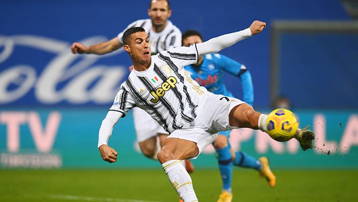 REGGIO NELL'EMILIA, ITALY - JANUARY 20: Cristiano Ronaldo of Juventus scores their sides first goal during the Italian PS5 Supercup match between Juventus and SSC Napoli at Mapei Stadium - Citta' del Tricolore on January 20, 2021 in Reggio nell'Emilia, Italy. Sporting stadiums around Italy remain under strict restrictions due to the Coronavirus Pandemic as Government social distancing laws prohibit fans inside venues resulting in games being played behind closed doors. (Photo by Claudio Villa/Getty Images) 