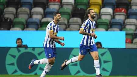 AVEIRO, PORTUGAL - DECEMBER 23: Sergio Oliveira of FC Porto celebrates after scoring their sides first goal during the Portuguese Super Cup final between FC Porto and SL Benfica at Estadio Municipal de Aveiro on December 23, 2020 in Aveiro, Portugal. Sporting stadiums around Portugal remain under strict restrictions due to the Coronavirus Pandemic as Government social distancing laws prohibit fans inside venues resulting in games being played behind closed doors. (Photo by Octavio Passos/Getty Images)