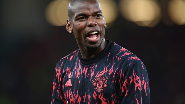 MANCHESTER, ENGLAND - MARCH 15: Paul Pogba of Manchester United warms up prior to the UEFA Champions League Round Of Sixteen Leg Two match between Manchester United and Atletico Madrid at Old Trafford on March 15, 2022 in Manchester, England. (Photo by Michael Regan/Getty Images) Juve, Gazzetta: “La firma di Paul Pogba è soltanto una questione di giorni” - immagine 1