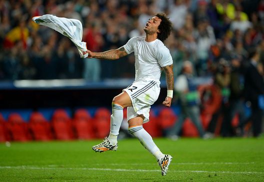 LISBON, PORTUGAL - MAY 24: Marcelo of Real Madrid celebrates victory at the final whistle in the UEFA Champions League Final between Real Madrid and Atletico de Madrid at Estadio da Luz on May 24, 2014 in Lisbon, Portugal. (Photo by Michael Regan/Getty Images) LISBON, PORTUGAL - MAY 24: Marcelo of Real Madrid celebrates victory at the final whistle in the UEFA Champions League Final between Real Madrid and Atletico de Madrid at Estadio da Luz on May 24, 2014 in Lisbon, Portugal. (Photo by Michael Regan/Getty Images)