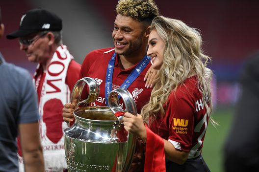 MADRID, SPAIN - JUNE 01: Alex Oxlade-Chamberlain of Liverpool celebrates with his girlfriend Perrie Edwards after his side won during the UEFA Champions League Final between Tottenham Hotspur and Liverpool at Estadio Wanda Metropolitano on June 01, 2019 in Madrid, Spain. (Photo by Michael Regan/Getty Images) MADRID, SPAIN - JUNE 01: Alex Oxlade-Chamberlain of Liverpool celebrates with his girlfriend Perrie Edwards after his side won during the UEFA Champions League Final between Tottenham Hotspur and Liverpool at Estadio Wanda Metropolitano on June 01, 2019 in Madrid, Spain. (Photo by Michael Regan/Getty Images)