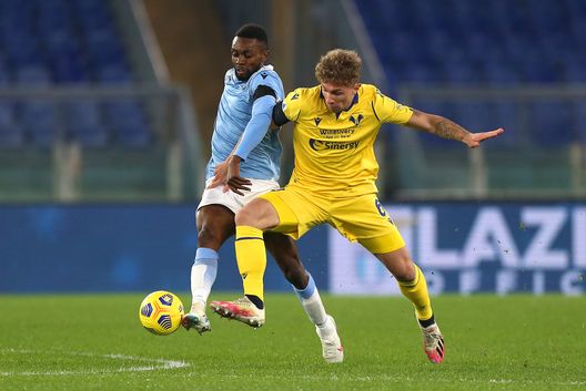 ROME, ITALY - DECEMBER 12: Jean-Daniel Akpa Akpro battles for possession with Matteo Lovato of Hellas Verona F.C. during the Serie A match between SS Lazio and Hellas Verona FC at Stadio Olimpico on December 12, 2020 in Rome, Italy. Sporting stadiums around Italy remain under strict restrictions due to the Coronavirus Pandemic as Government social distancing laws prohibit fans inside venues resulting in games being played behind closed doors. (Photo by Paolo Bruno/Getty Images) ROME, ITALY - DECEMBER 12: Jean-Daniel Akpa Akpro battles for possession with Matteo Lovato of Hellas Verona F.C. during the Serie A match between SS Lazio and Hellas Verona FC at Stadio Olimpico on December 12, 2020 in Rome, Italy. Sporting stadiums around Italy remain under strict restrictions due to the Coronavirus Pandemic as Government social distancing laws prohibit fans inside venues resulting in games being played behind closed doors. (Photo by Paolo Bruno/Getty Images)