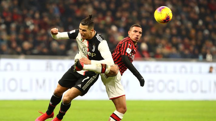 MILAN, ITALY - FEBRUARY 13:  Cristiano Ronaldo of Juventus competes for the ball with Ismael Bennacer of AC Milan during the Coppa Italia Semi Final match between AC Milan and Juventus at Stadio Giuseppe Meazza on February 13, 2020 in Milan, Italy.  (Photo by Marco Luzzani/Getty Images) 