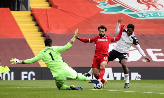LIVERPOOL, ENGLAND - MARCH 07: Mohamed Salah of Liverpool is challenged by Alphonse Areola and Ola Aina of Fulham during the Premier League match between Liverpool and Fulham at Anfield on March 07, 2021 in Liverpool, England. Sporting stadiums around the UK remain under strict restrictions due to the Coronavirus Pandemic as Government social distancing laws prohibit fans inside venues resulting in games being played behind closed doors. (Photo by Clive Brunskill/Getty Images) LIVERPOOL, ENGLAND - MARCH 07: Mohamed Salah of Liverpool is challenged by Alphonse Areola and Ola Aina of Fulham during the Premier League match between Liverpool and Fulham at Anfield on March 07, 2021 in Liverpool, England. Sporting stadiums around the UK remain under strict restrictions due to the Coronavirus Pandemic as Government social distancing laws prohibit fans inside venues resulting in games being played behind closed doors. (Photo by Clive Brunskill/Getty Images)