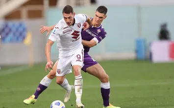 FLORENCE, ITALY - SEPTEMBER 19: Nikola Milenkovic of ACF Fiorentina battles for the ball with Andrea Belotti of Torino FC during the Serie A match between ACF Fiorentina and Torino FC at Stadio Artemio Franchi on September 19, 2020 in Florence, Italy.  (Photo by Gabriele Maltinti/Getty Images)
