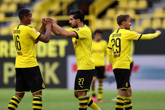 DORTMUND, GERMANY - JUNE 06: Emre Can, Manuel Akanji and Marcel Schmelzer of Borussia Dortmund celebrate after victory in the Bundesliga match between Borussia Dortmund and Hertha BSC at Signal Iduna Park on June 06, 2020 in Dortmund, Germany. (Photo by Lars Baron/Getty Images)  Champions League