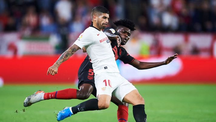 SEVILLE, SPAIN - NOVEMBER 02: Ever Banega of Sevilla FC (R) duels for the ball with Thomas Teye Partey of Club Atletico de Madrid (L) during the Liga match between Sevilla FC and Club Atletico de Madrid at Estadio Ramon Sanchez Pizjuan on November 02, 2019 in Seville, Spain. (Photo by Aitor Alcalde/Getty Images) SEVILLE, SPAIN - NOVEMBER 02: Ever Banega of Sevilla FC (R) duels for the ball with Thomas Teye Partey of Club Atletico de Madrid (L) during the Liga match between Sevilla FC and Club Atletico de Madrid at Estadio Ramon Sanchez Pizjuan on November 02, 2019 in Seville, Spain. (Photo by Aitor Alcalde/Getty Images)